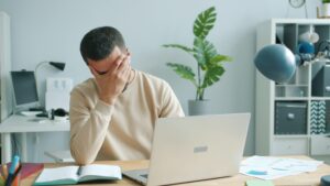 Frustrated man researching how to sell his oil and gas rights in Texas